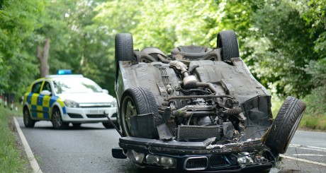 totaled car in the road