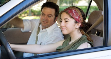 dad teaching teenager how to drive