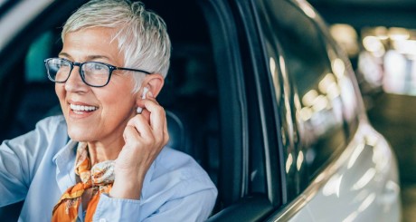 elderly woman driving car