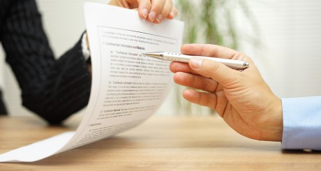insurance agent and customer reviewing policy